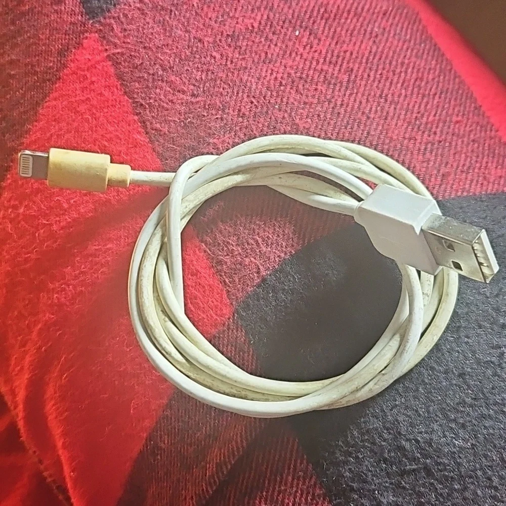 Bundle of white USB to Apple Lightning Charging Cables